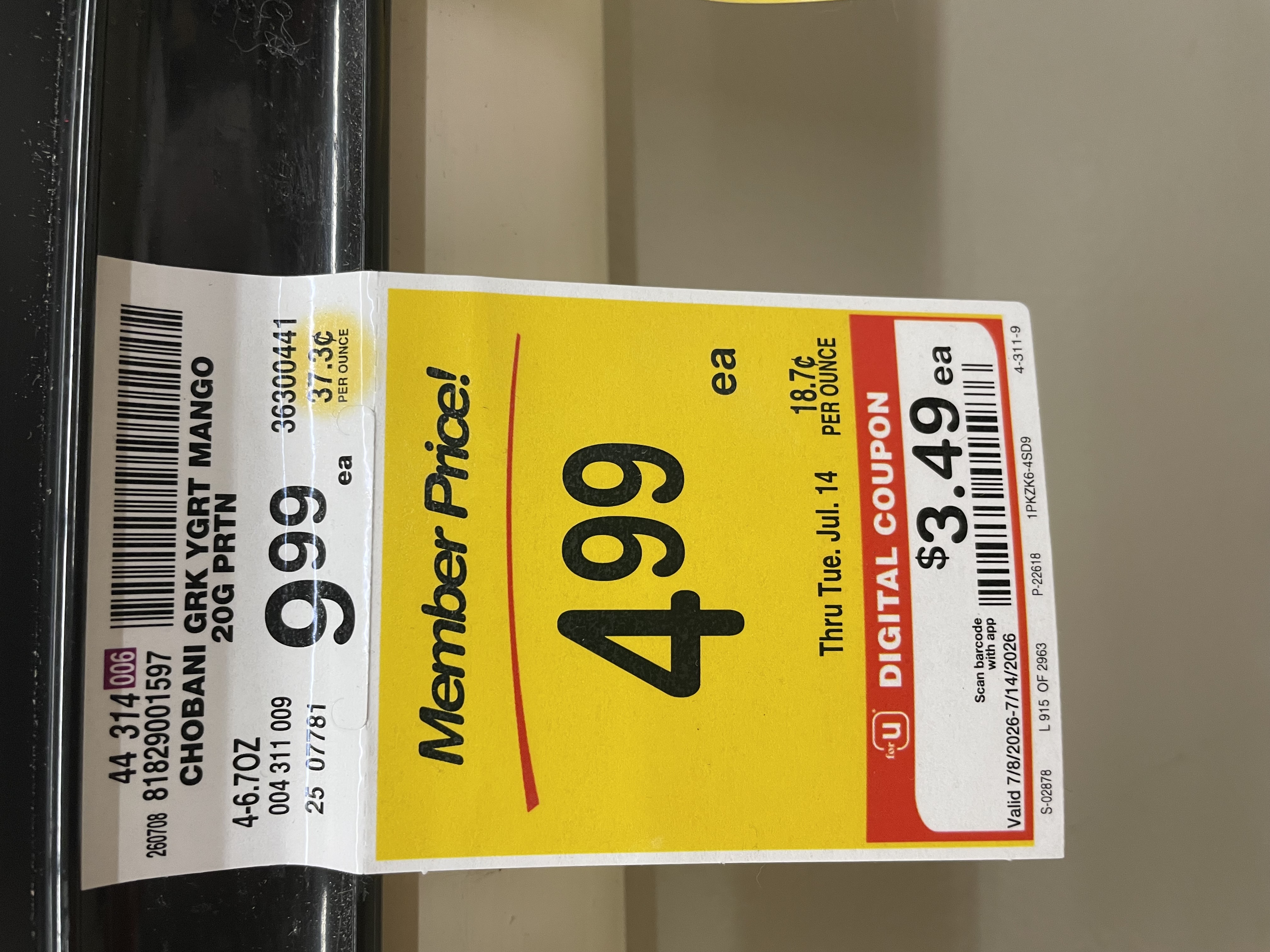 A store sign showing mango Chobani protein yogurt marked down to three dollars and forty-nine cents