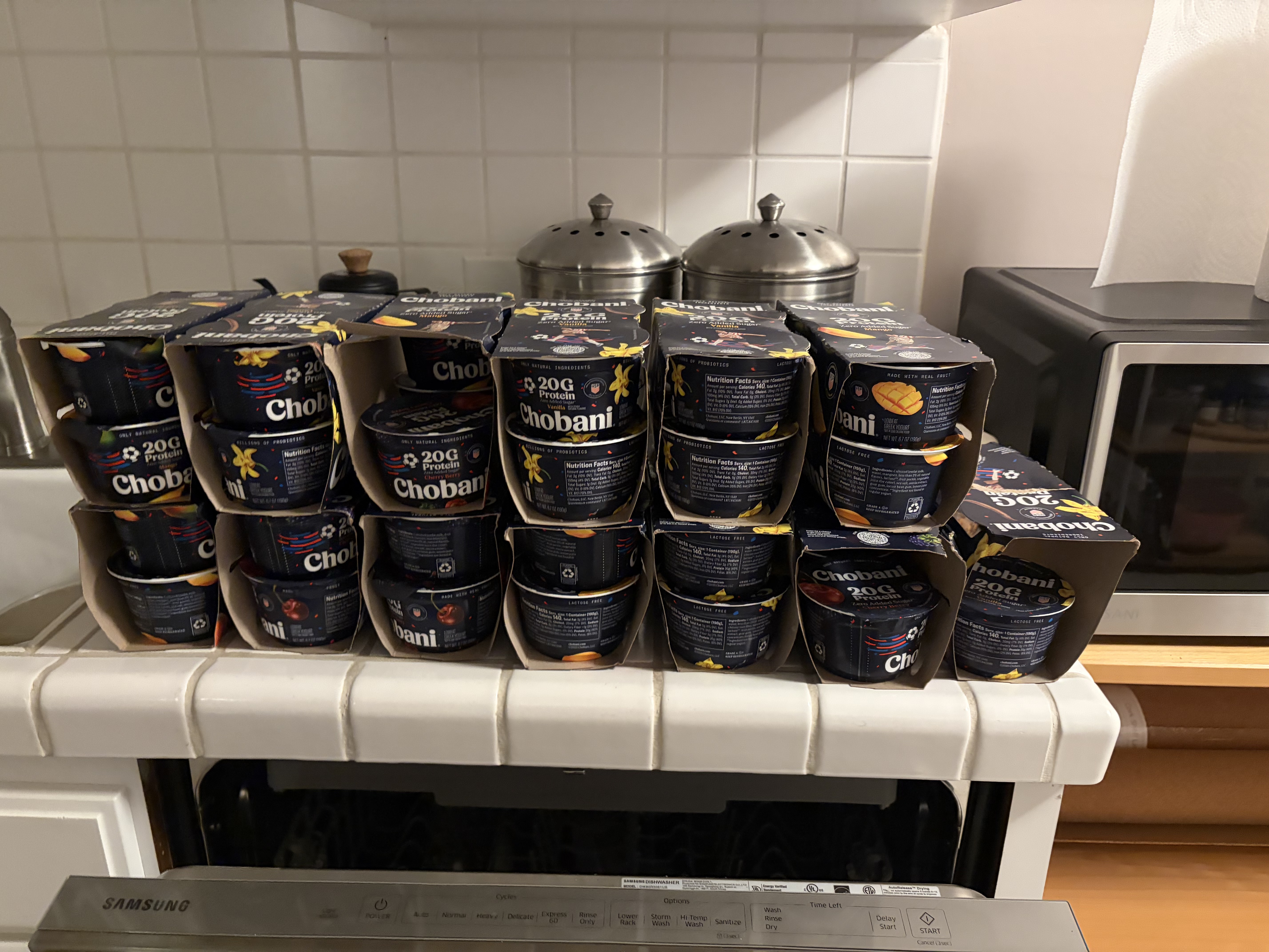 A kitchen pantry filled with mango Chobani yogurt
